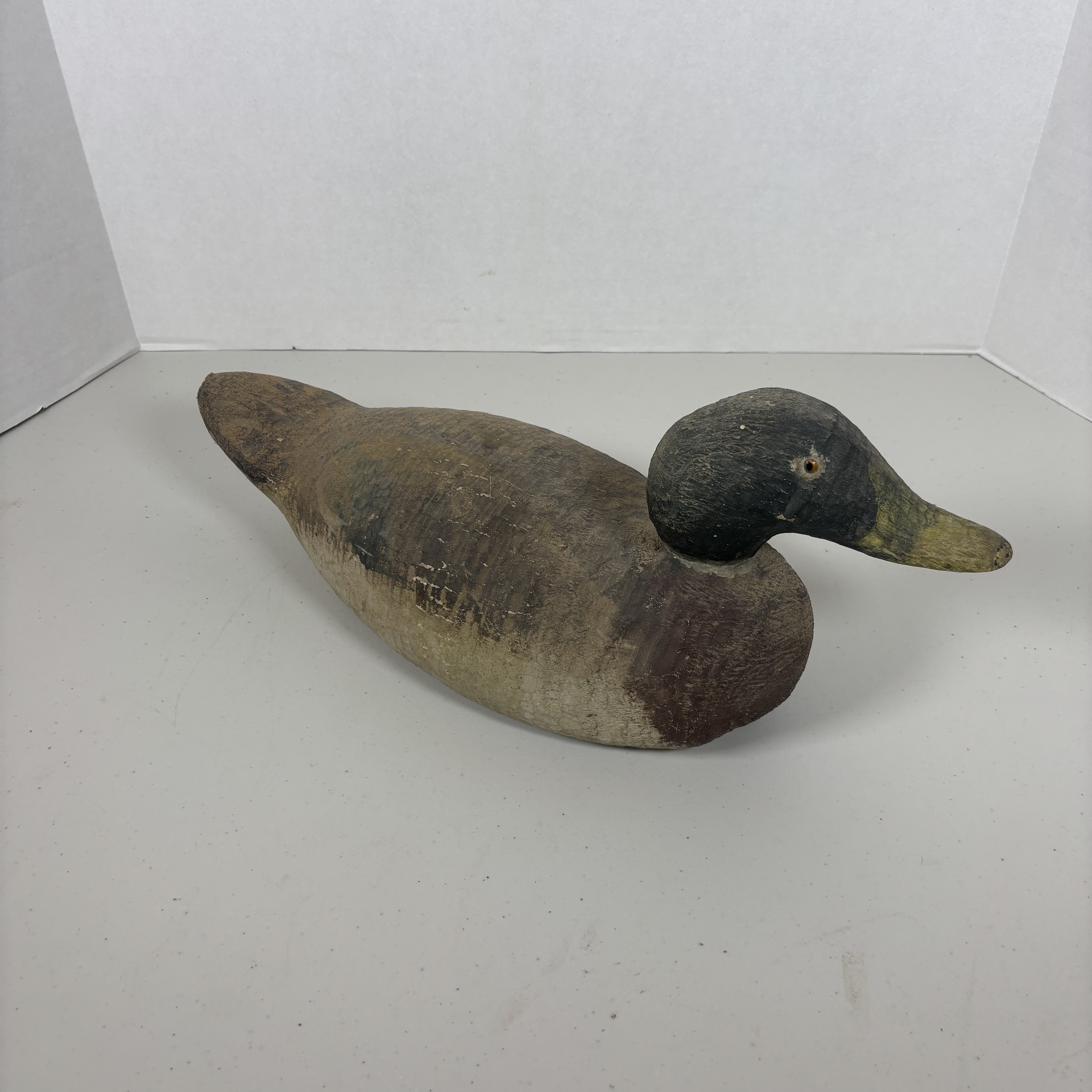 Vintage hand-carved wood duck hunting decoy with glass eyes